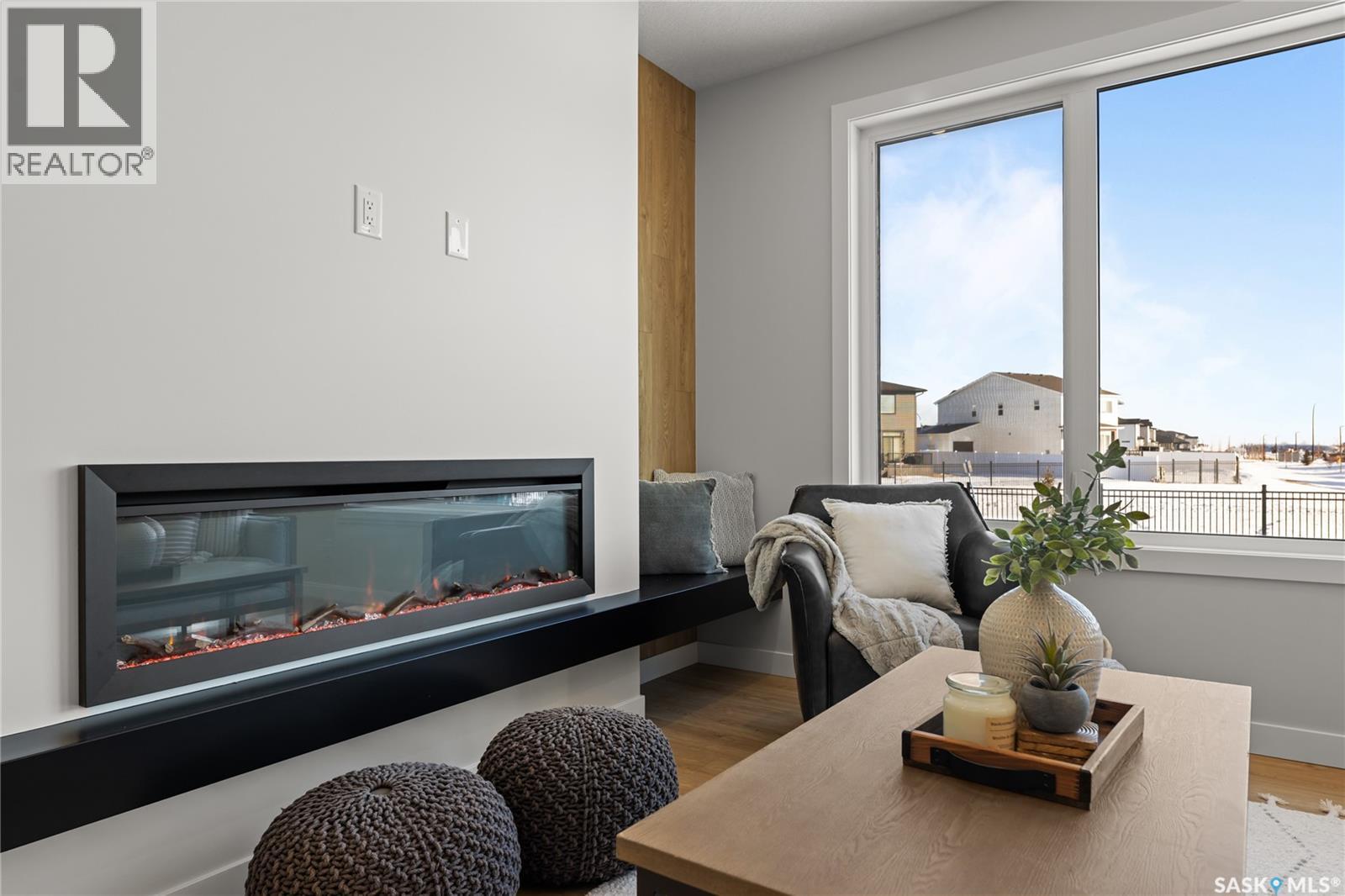 934 Brighton Gate, Saskatoon, SK - Indoor Photo Showing Other Room With Fireplace