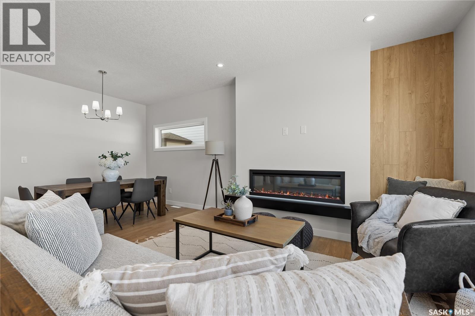 934 Brighton Gate, Saskatoon, SK - Indoor Photo Showing Living Room With Fireplace