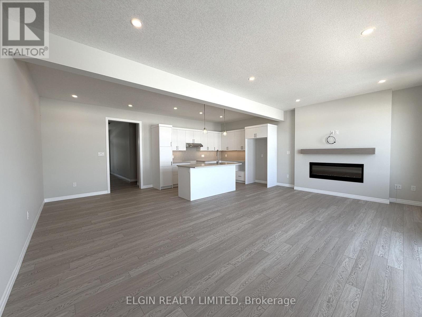 55 Woodcock Drive, Tillsonburg, ON - Indoor Photo Showing Living Room With Fireplace
