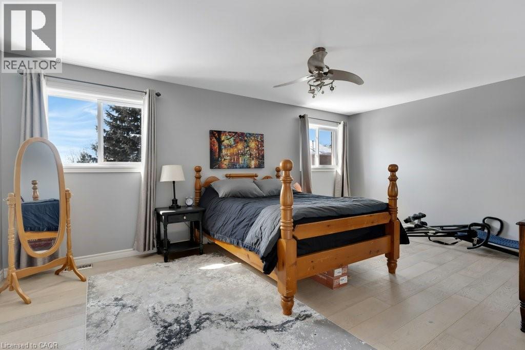 Bedroom featuring light wood-style floors and a ceiling fan - 148 Cowan Boulevard, Cambridge, ON - Indoor Photo Showing Bedroom