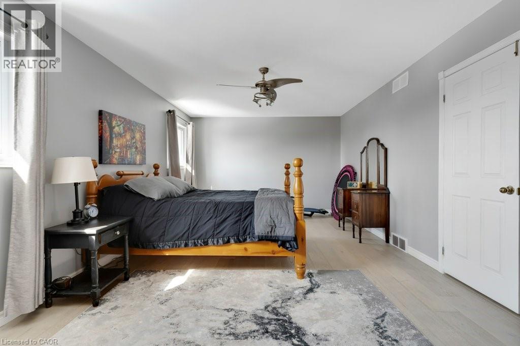 Bedroom with light wood-style flooring and ceiling fan - 148 Cowan Boulevard, Cambridge, ON - Indoor Photo Showing Bedroom