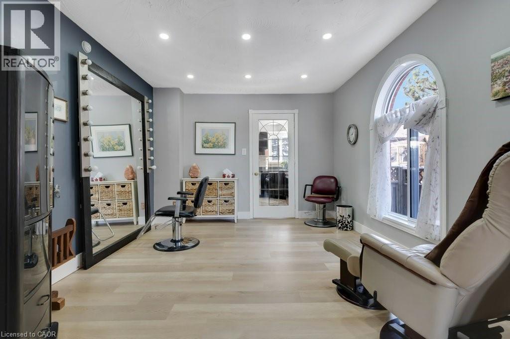 Living area featuring light wood finished floors and recessed lighting - 148 Cowan Boulevard, Cambridge, ON - Indoor