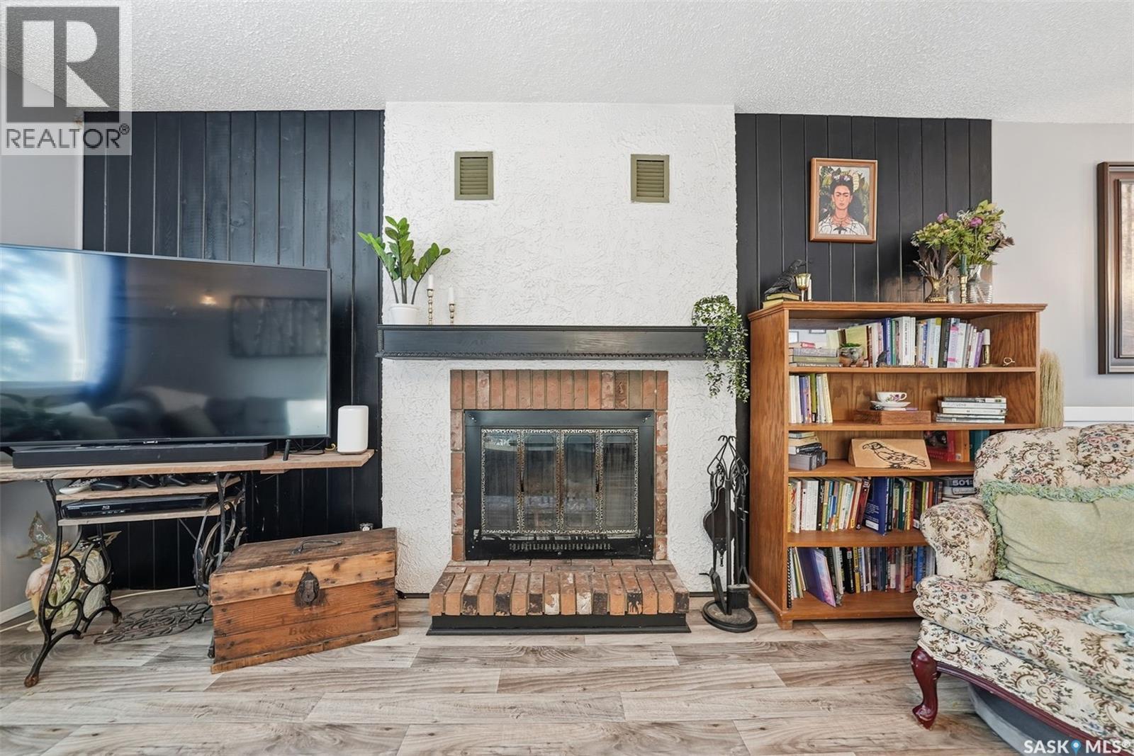 42 Macdowall Crescent, Prince Albert, SK - Indoor Photo Showing Living Room With Fireplace
