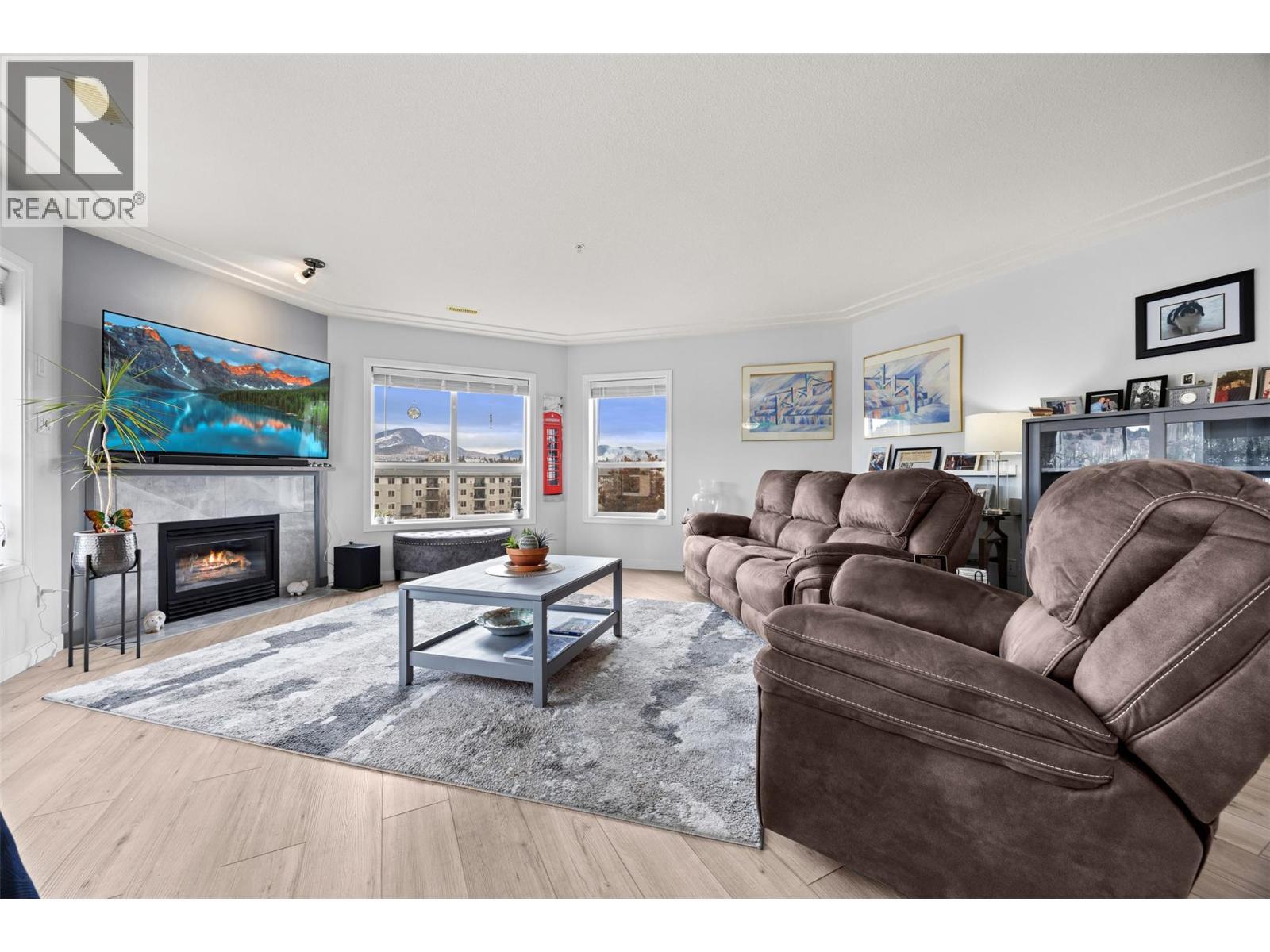 Living - 1895 Ambrosi Road Unit# 502, Kelowna, BC - Indoor Photo Showing Living Room With Fireplace