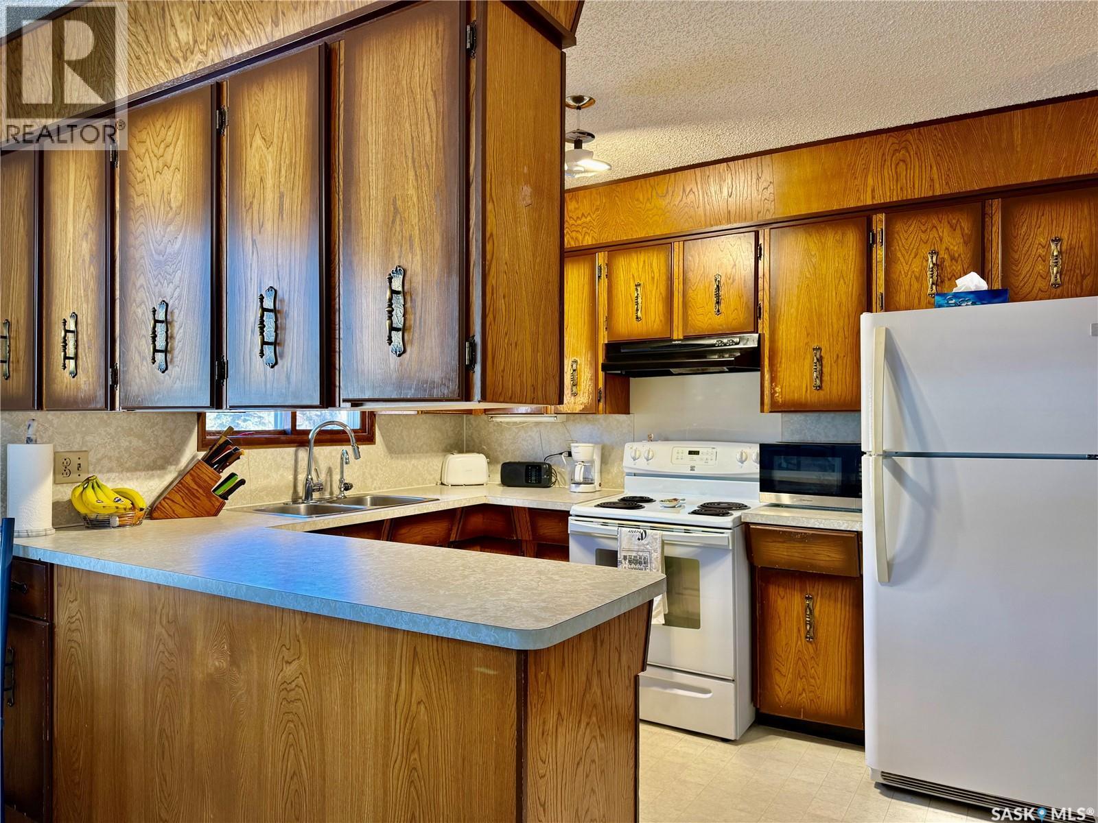 1107 Centennial Way, Humboldt, SK - Indoor Photo Showing Kitchen With Double Sink