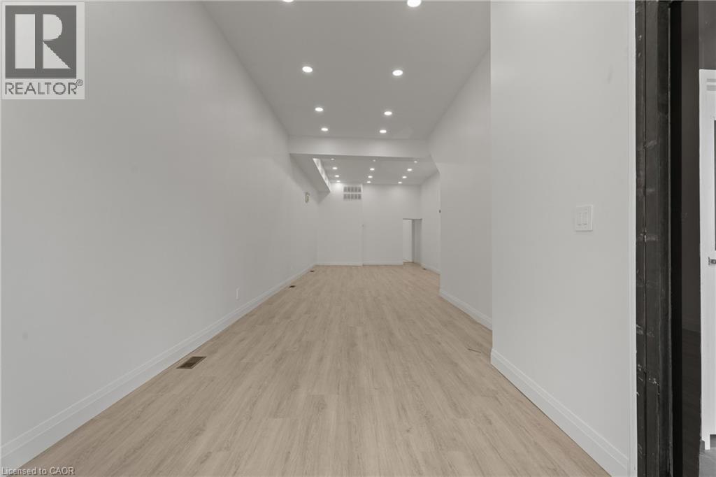 Hallway with recessed lighting and light wood-type flooring - 93 John Street S, Hamilton, ON