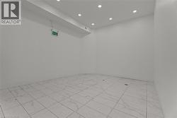 Empty room with recessed lighting -