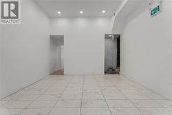 Empty room featuring recessed lighting and light marble finish floors -