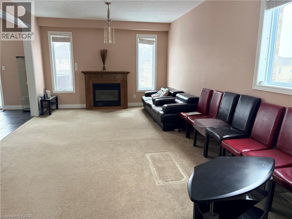 212 Westfield Place, Waterloo, ON - Indoor Photo Showing Living Room With Fireplace