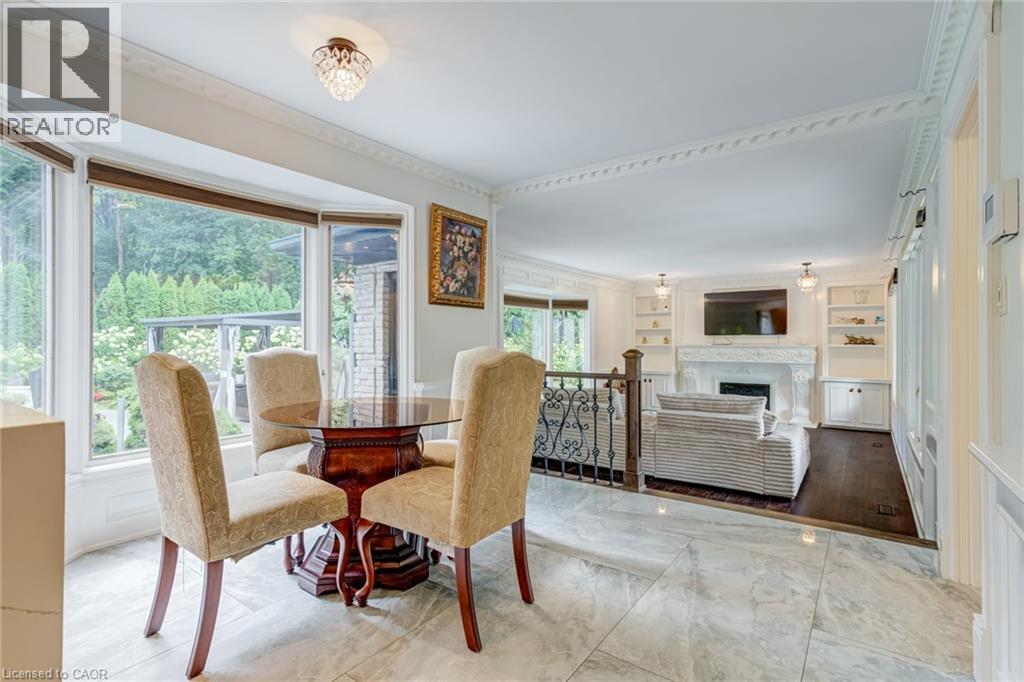 28 Stonegate Drive, Hamilton, ON - Indoor Photo Showing Dining Room With Fireplace