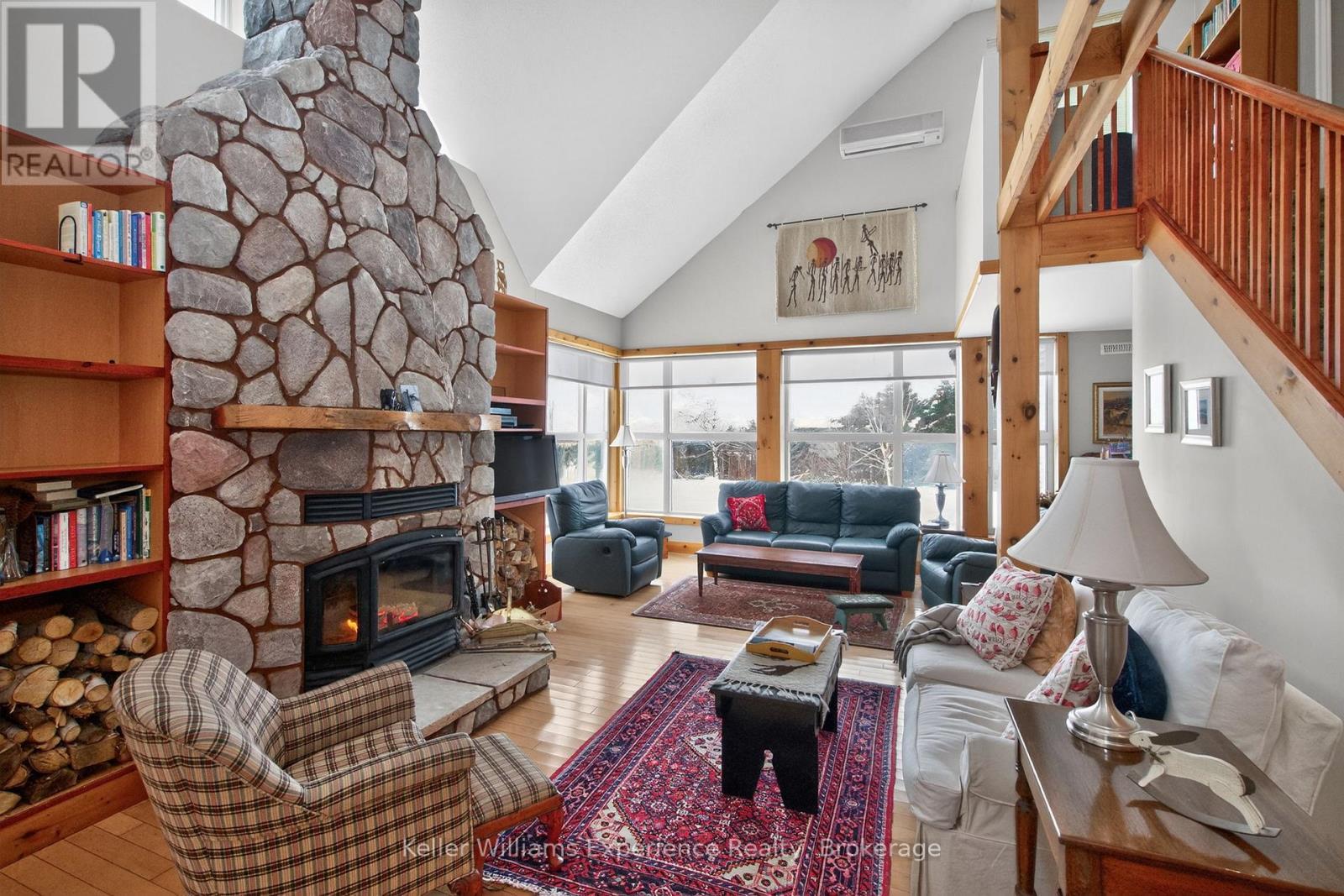 257 15 Concession E, Tiny, ON - Indoor Photo Showing Living Room With Fireplace