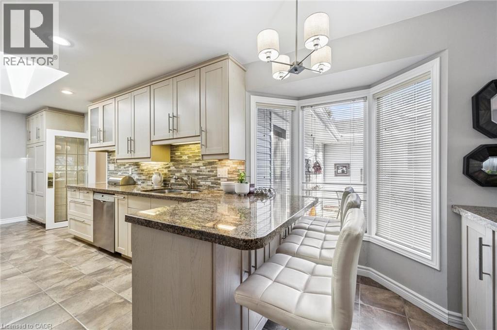 Breakfast bar - 3012 First Street, Burlington, ON - Indoor Photo Showing Kitchen With Upgraded Kitchen