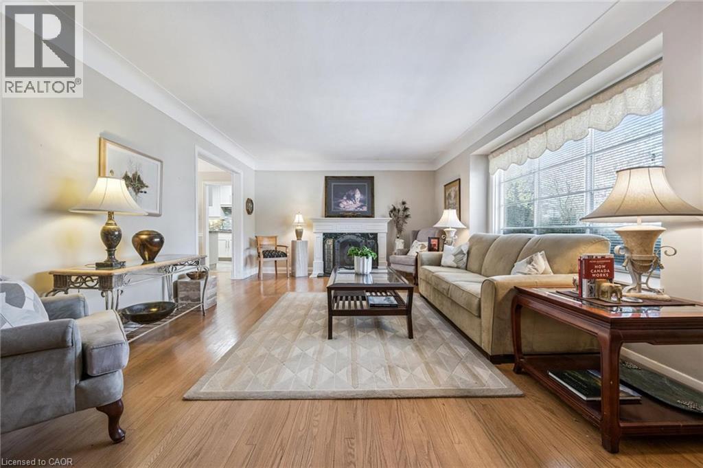 Fireplace. Hardwood flooring. - 3012 First Street, Burlington, ON - Indoor Photo Showing Living Room With Fireplace