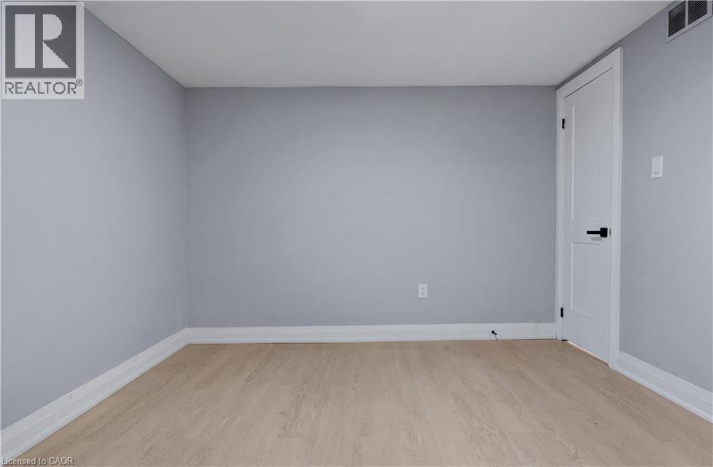 Spare room with light wood-style floors and baseboards - 19 Broad Street, Brantford, ON - Indoor Photo Showing Other Room