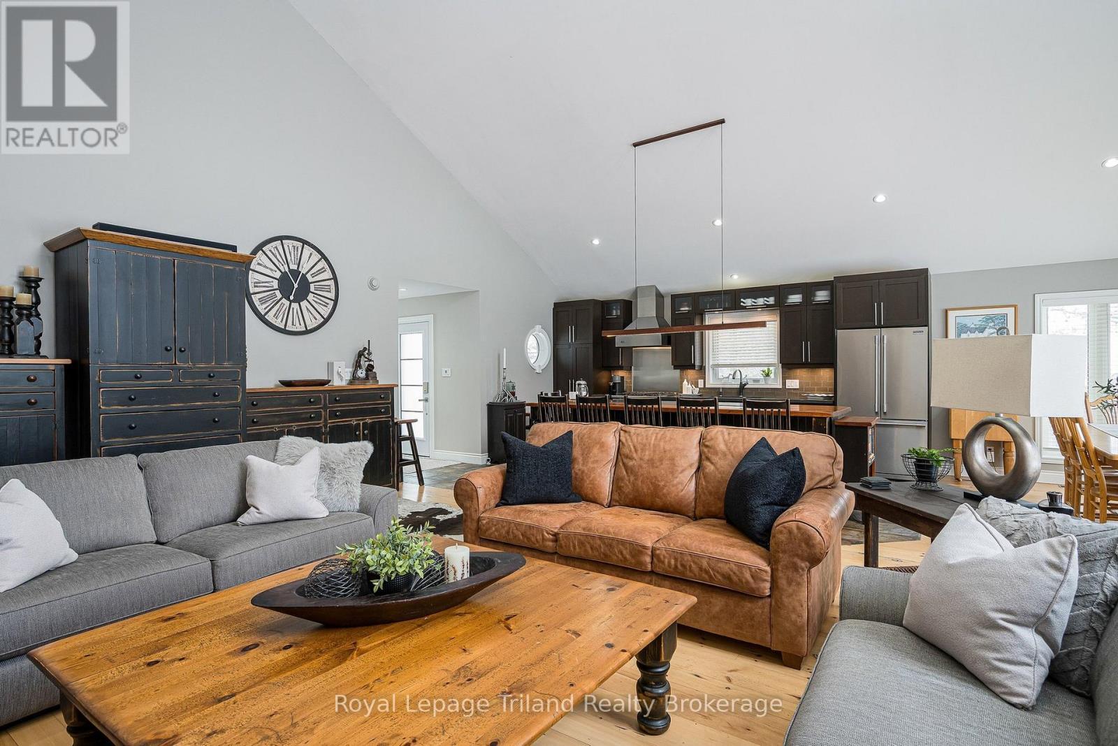 Wide-plank, natural wood floors ground the space - 19 Trails End, Collingwood, ON