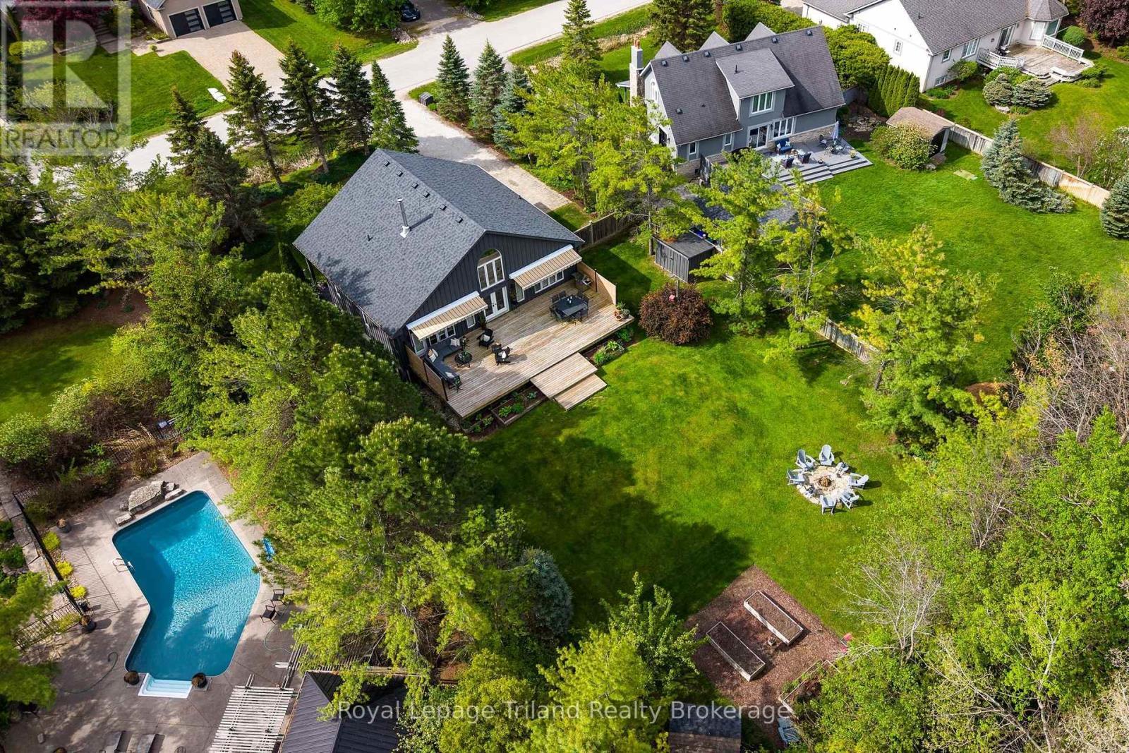 Aerial view of the backyard, framed by trees - 19 Trails End, Collingwood, ON
