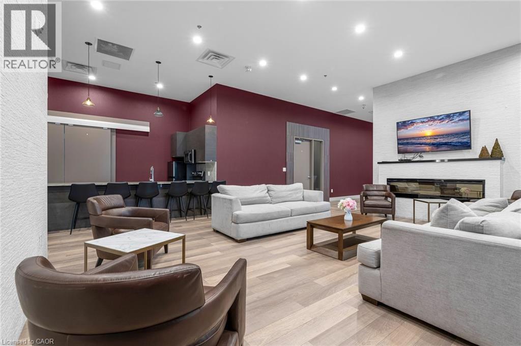 550 North Service Road Unit# 612, Grimsby, ON - Indoor Photo Showing Living Room With Fireplace