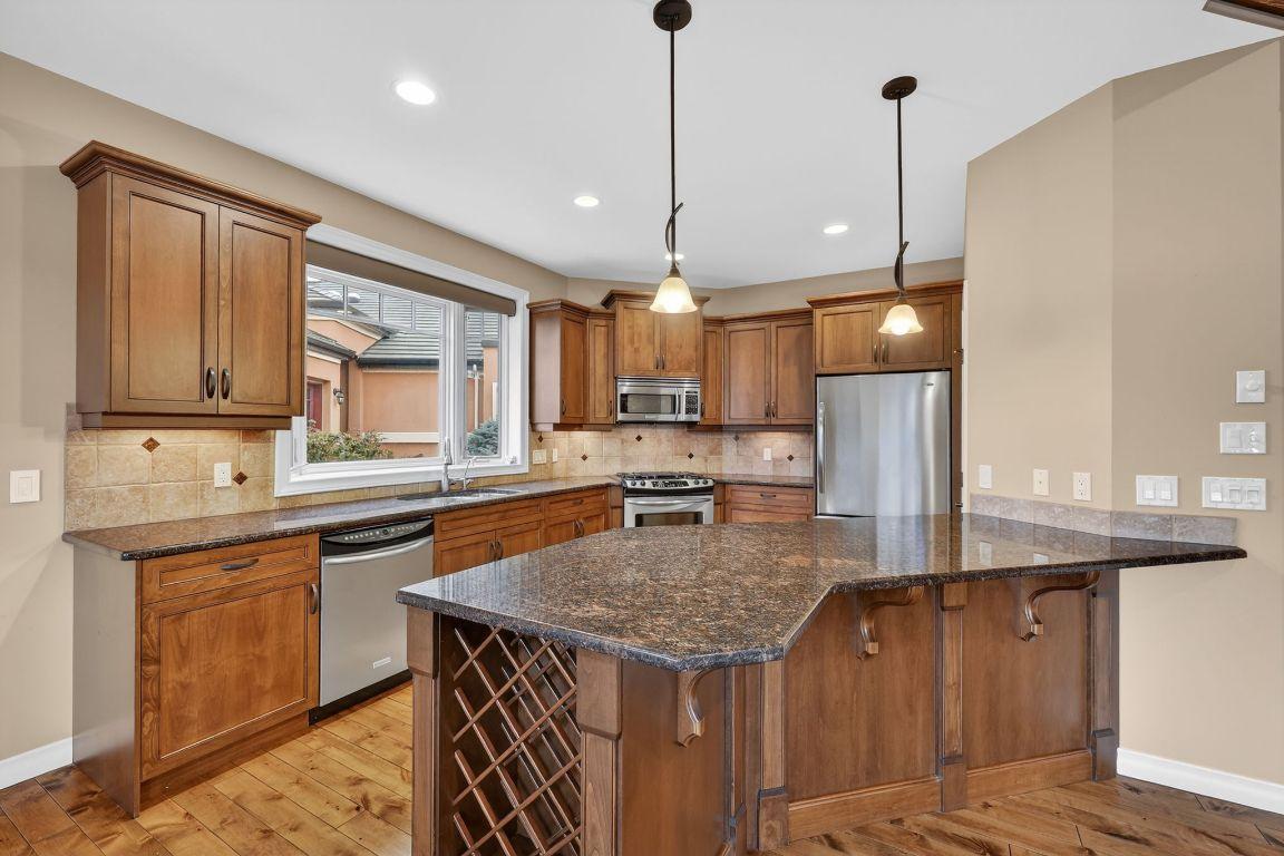 111-1910 Capistrano Drive, Kelowna, BC - Indoor Photo Showing Kitchen With Double Sink