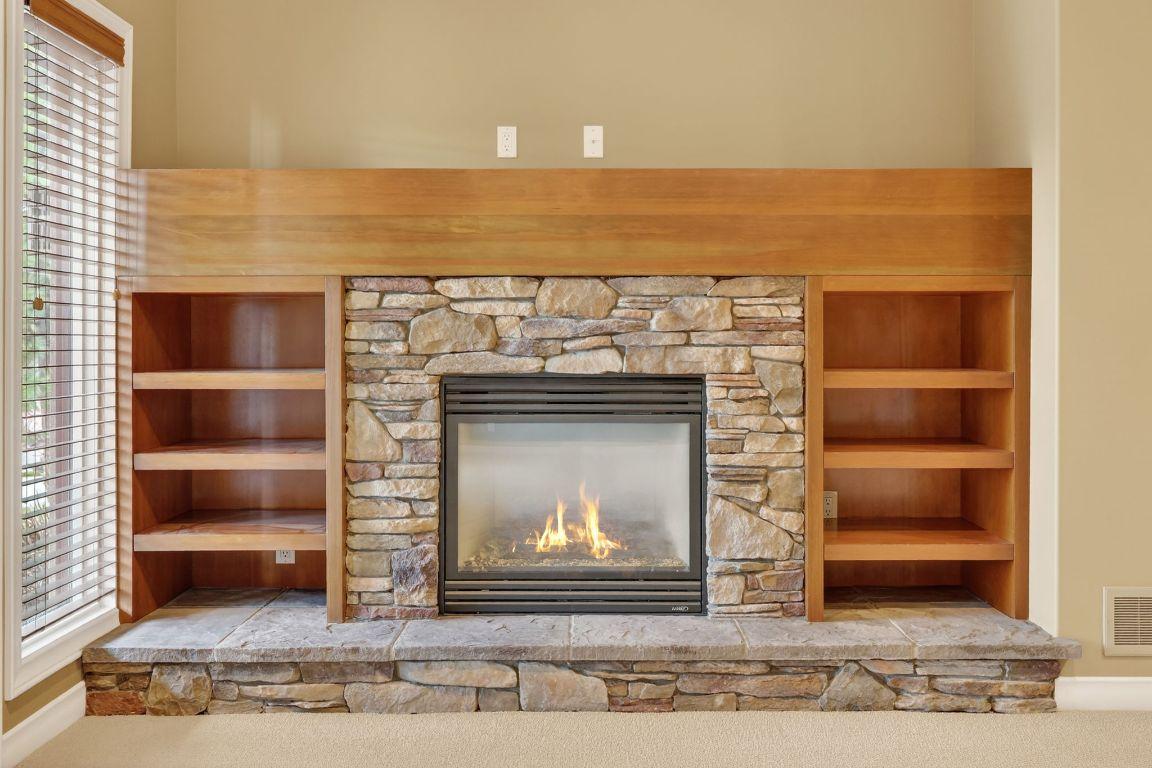 111-1910 Capistrano Drive, Kelowna, BC - Indoor Photo Showing Other Room With Fireplace
