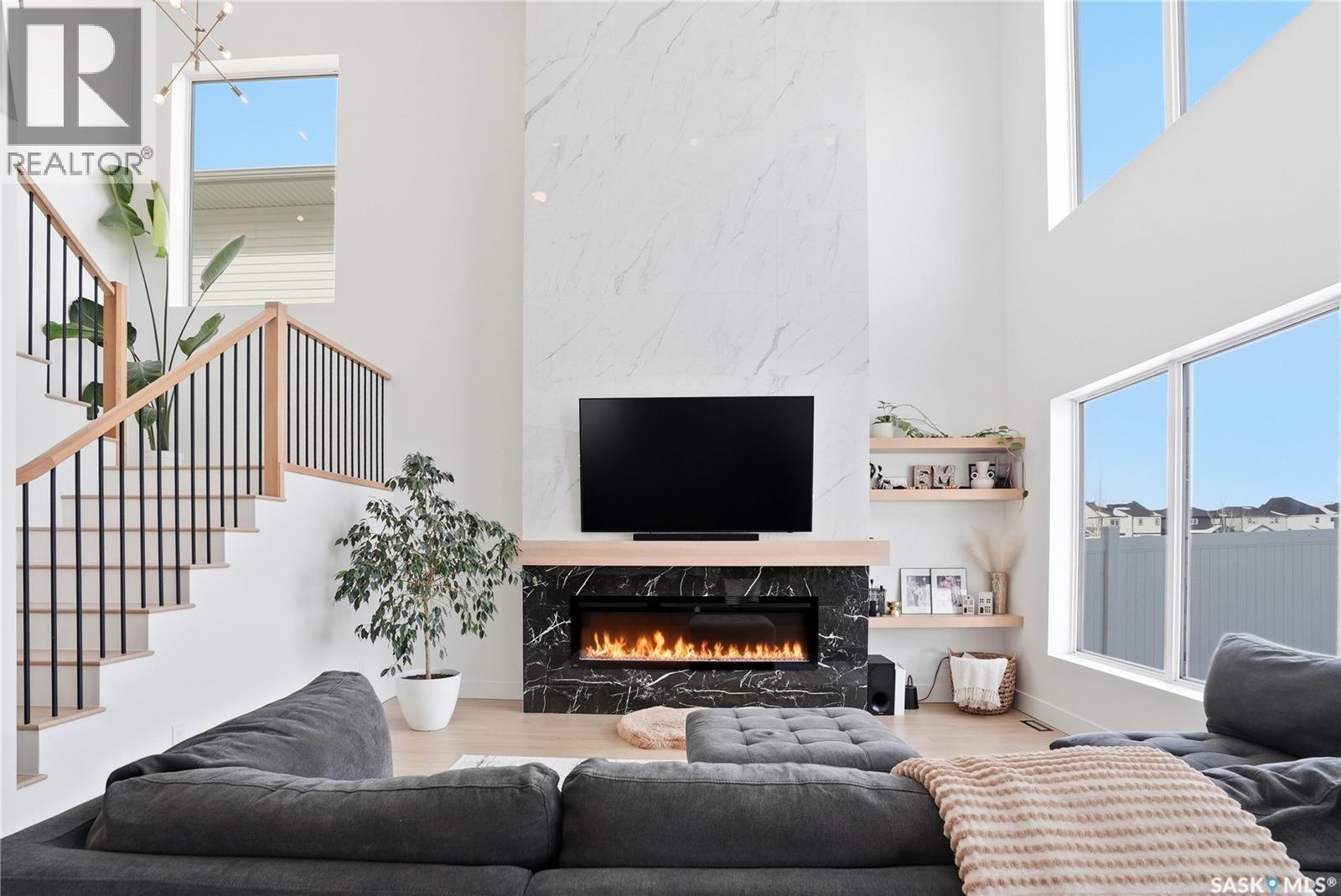 139 Woolf Bend, Saskatoon, SK - Indoor Photo Showing Living Room With Fireplace