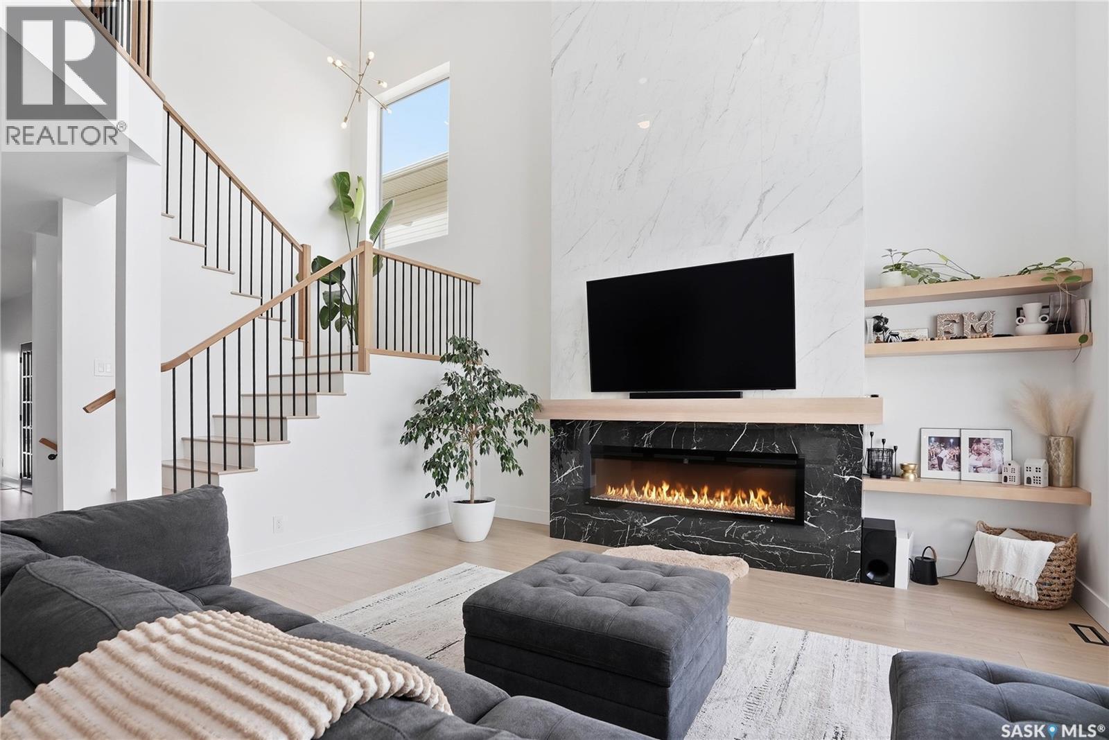 139 Woolf Bend, Saskatoon, SK - Indoor Photo Showing Living Room With Fireplace