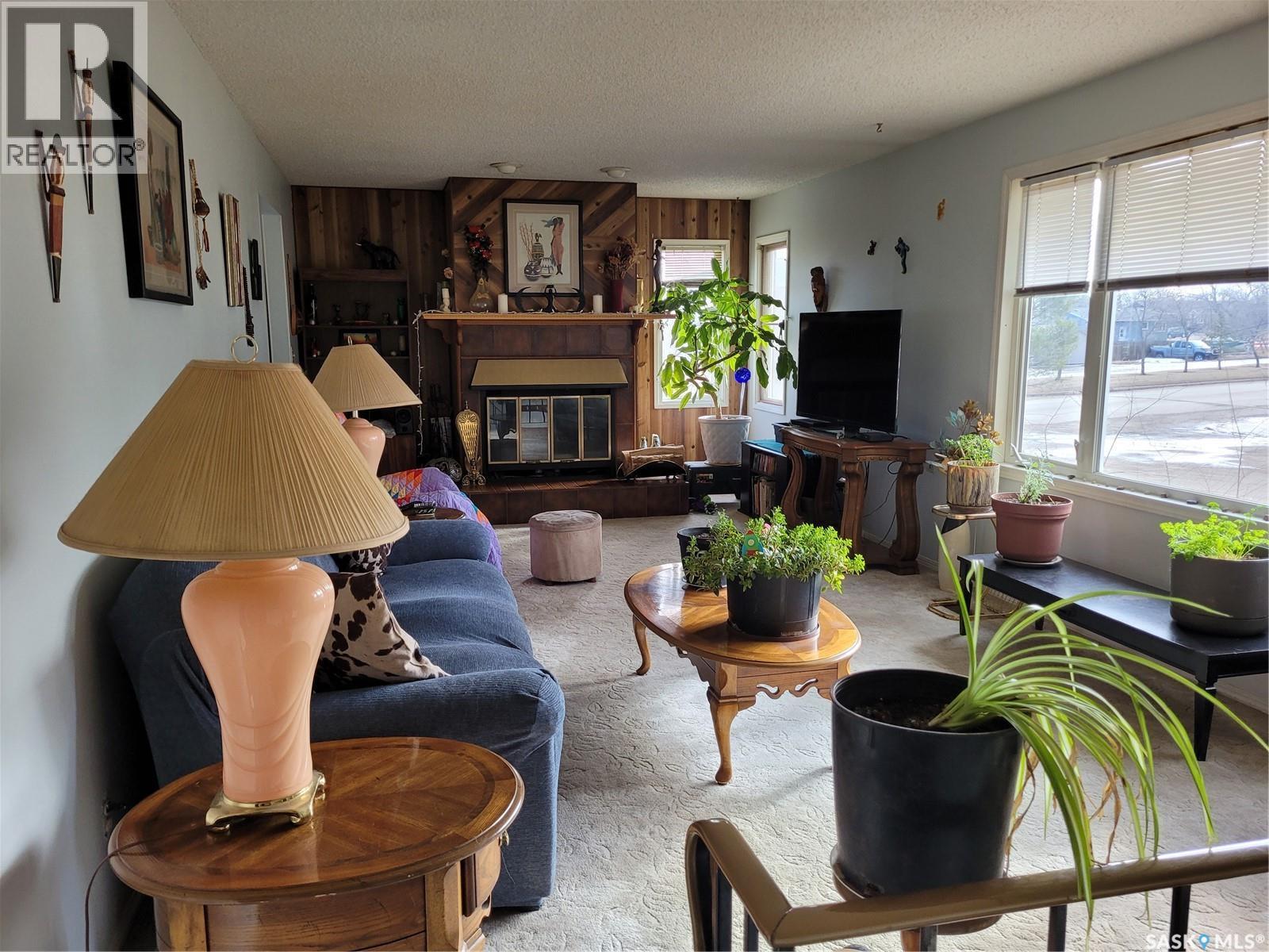 529 6Th Avenue E, Assiniboia, SK - Indoor Photo Showing Living Room With Fireplace