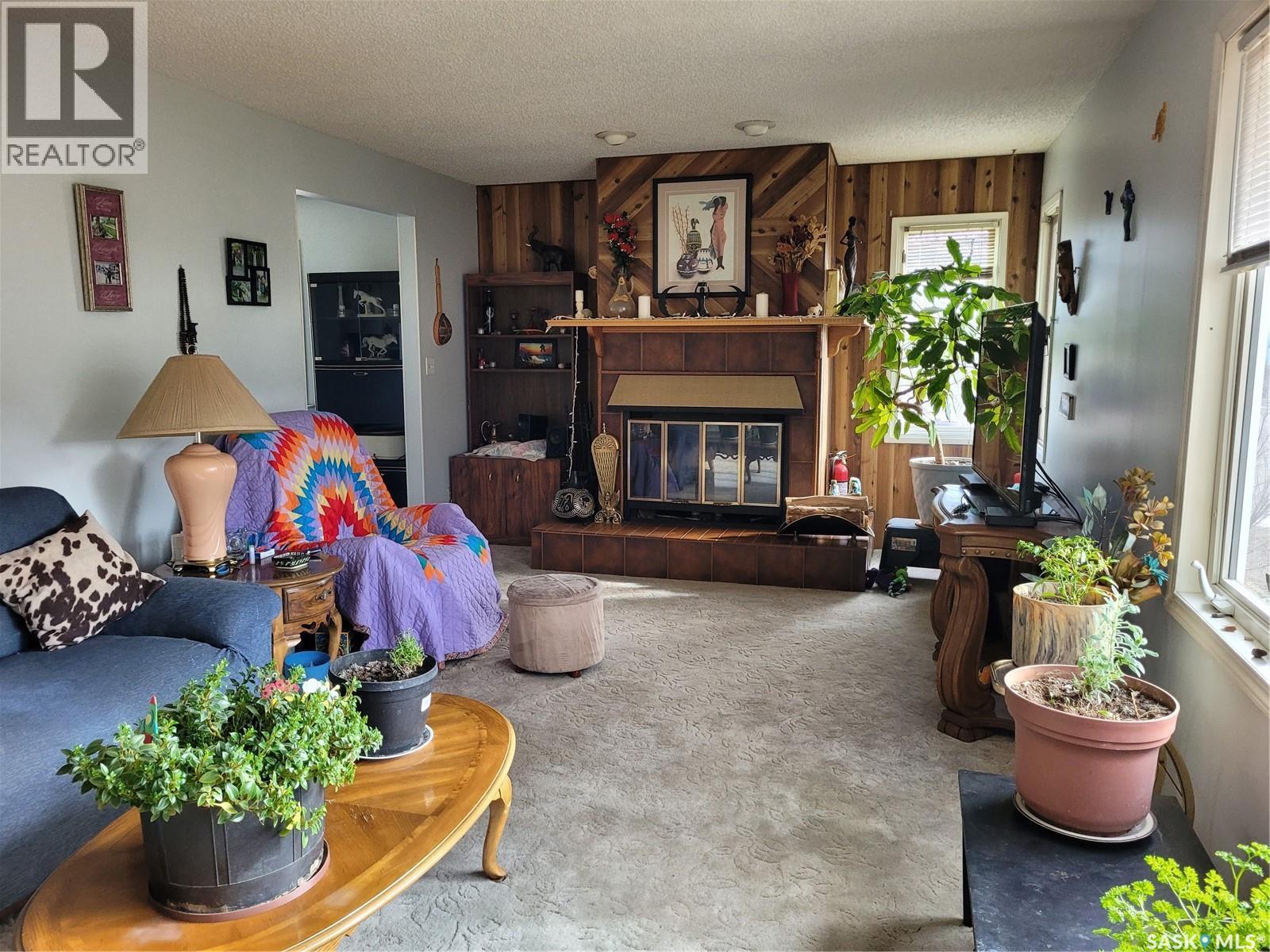 529 6Th Avenue E, Assiniboia, SK - Indoor Photo Showing Living Room With Fireplace