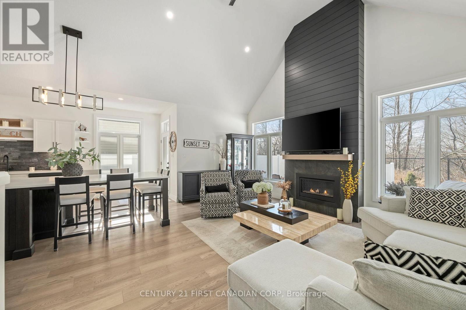 35 Compass Trail, Central Elgin, ON - Indoor Photo Showing Living Room With Fireplace