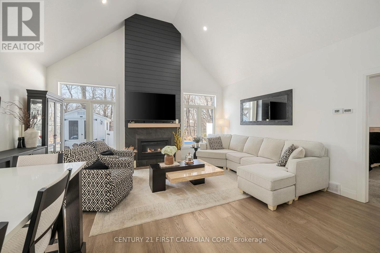 35 Compass Trail, Central Elgin, ON - Indoor Photo Showing Living Room With Fireplace