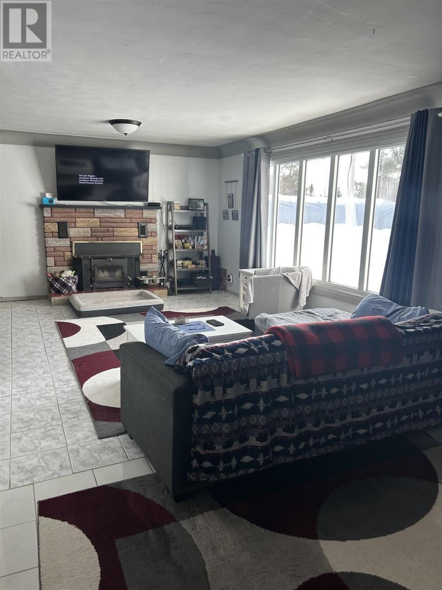 20 Warnock Rd, Iron Bridge, ON - Indoor Photo Showing Living Room With Fireplace