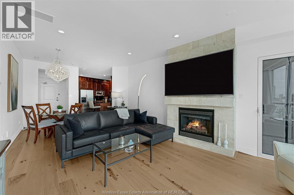 1225 Riverside Drive Unit# 404, Windsor, ON - Indoor Photo Showing Living Room With Fireplace