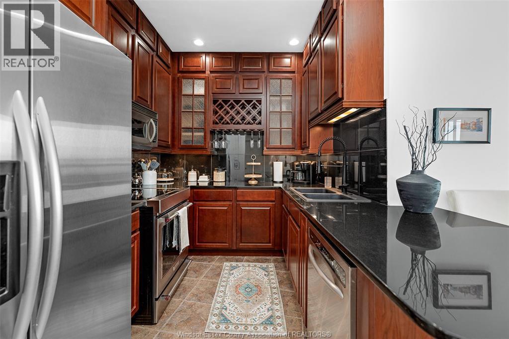 1225 Riverside Drive Unit# 404, Windsor, ON - Indoor Photo Showing Kitchen With Double Sink