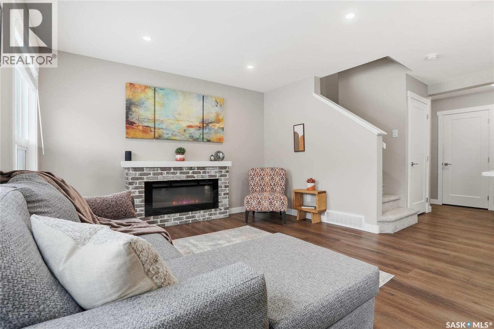 474 Schmeiser Bend, Saskatoon, SK - Indoor Photo Showing Living Room With Fireplace