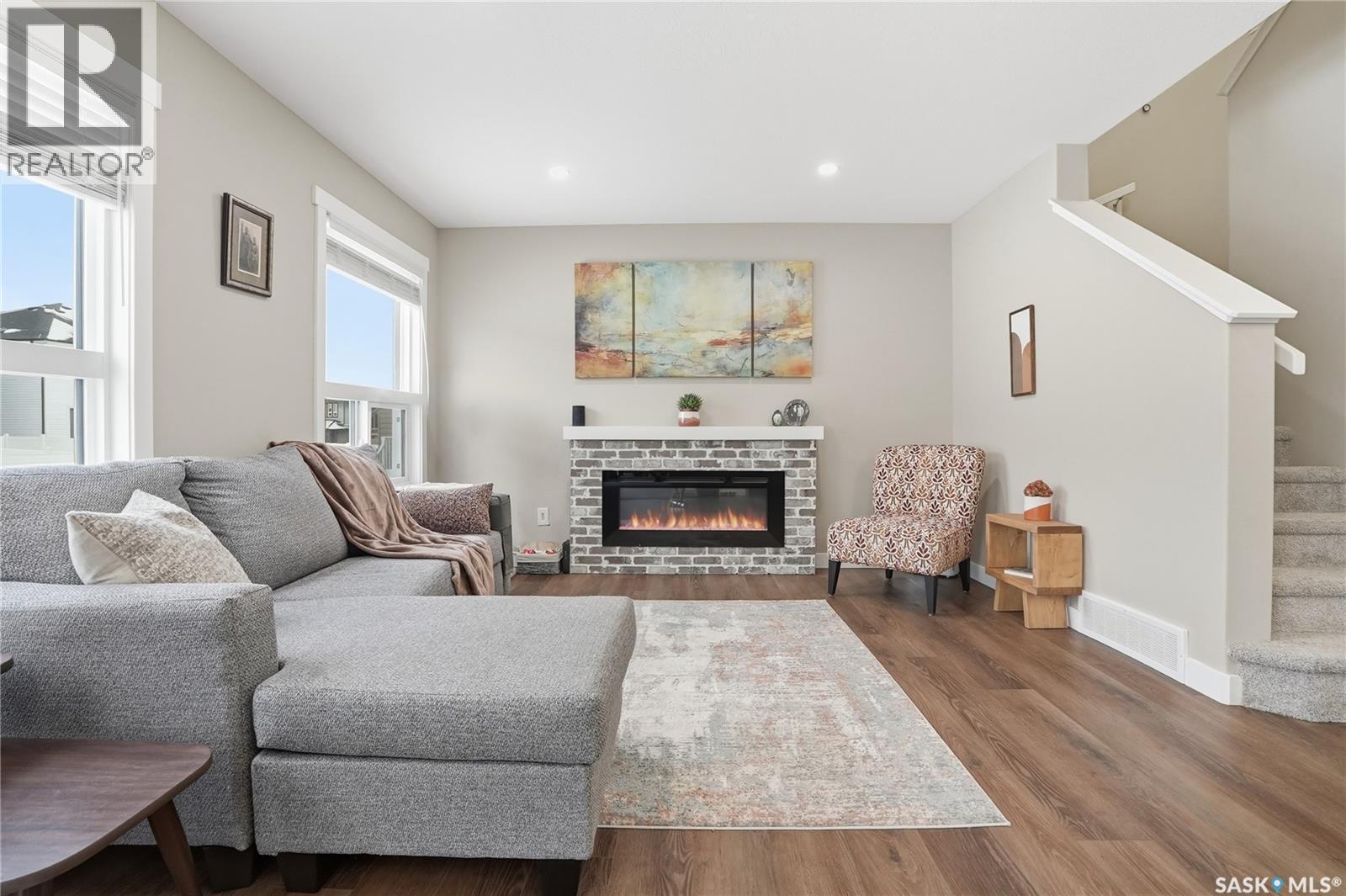 474 Schmeiser Bend, Saskatoon, SK - Indoor Photo Showing Living Room With Fireplace