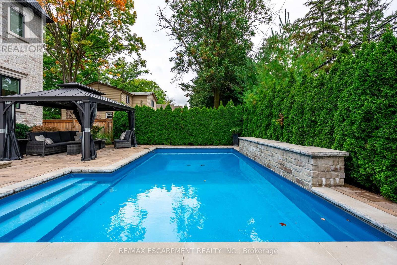 385 Pine Cove Road, Burlington, ON - Outdoor With In Ground Pool With Deck Patio Veranda With Backyard