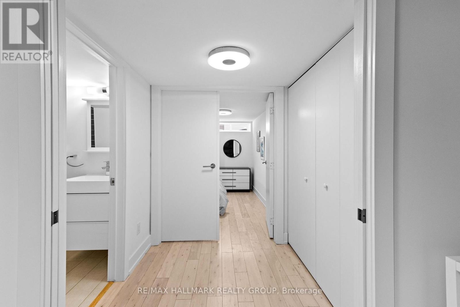 Lower level hallway, full bathroom, 4th bedroom - 330 Winona Avenue, Ottawa, ON - Indoor