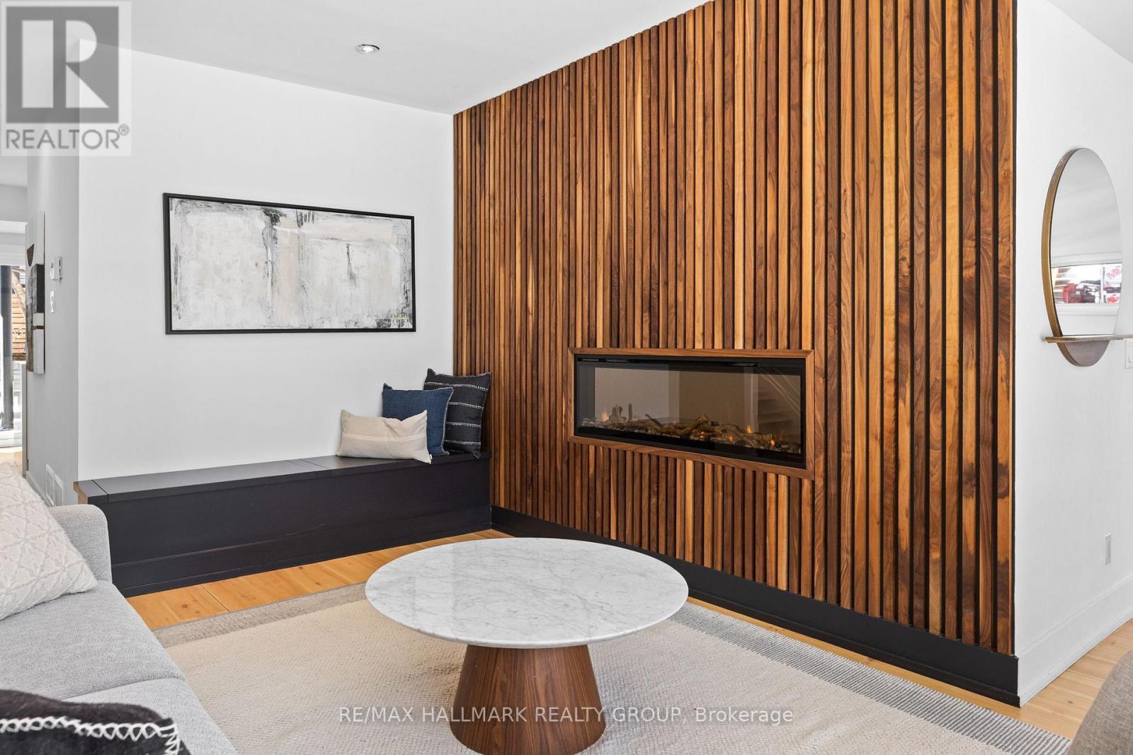 Custom wood slat wall with fireplace - 330 Winona Avenue, Ottawa, ON - Indoor With Fireplace