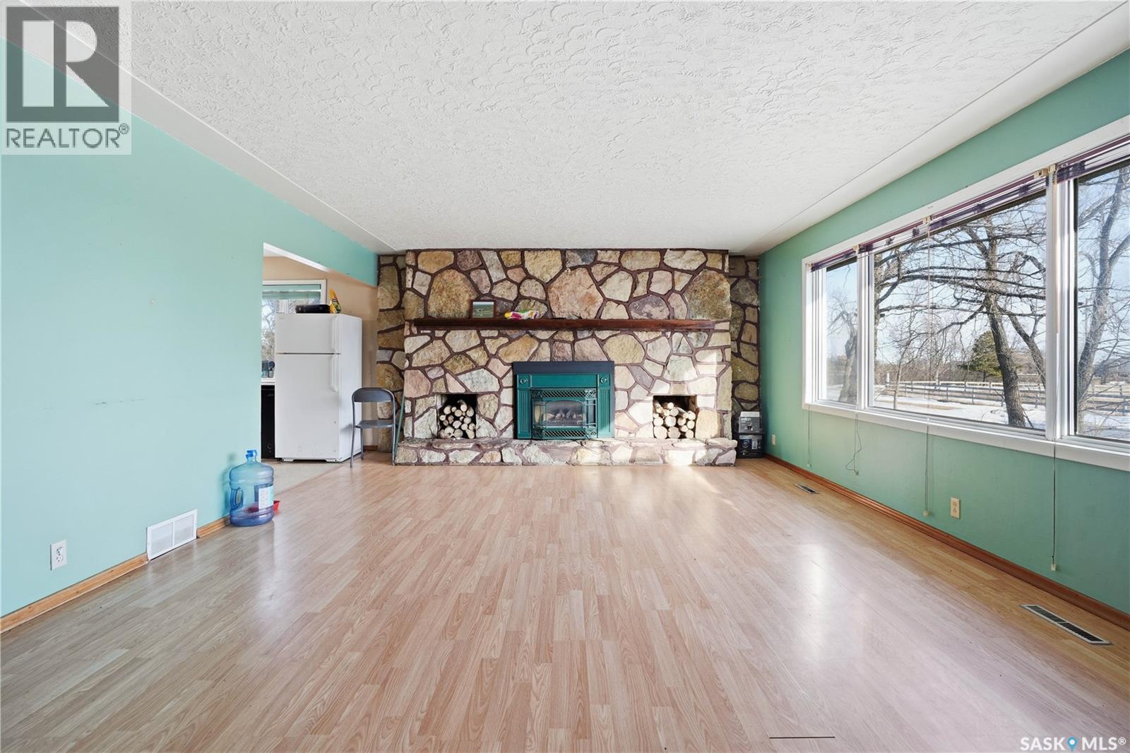 Chamberlain Acreage, Chamberlain, SK - Indoor Photo Showing Living Room With Fireplace