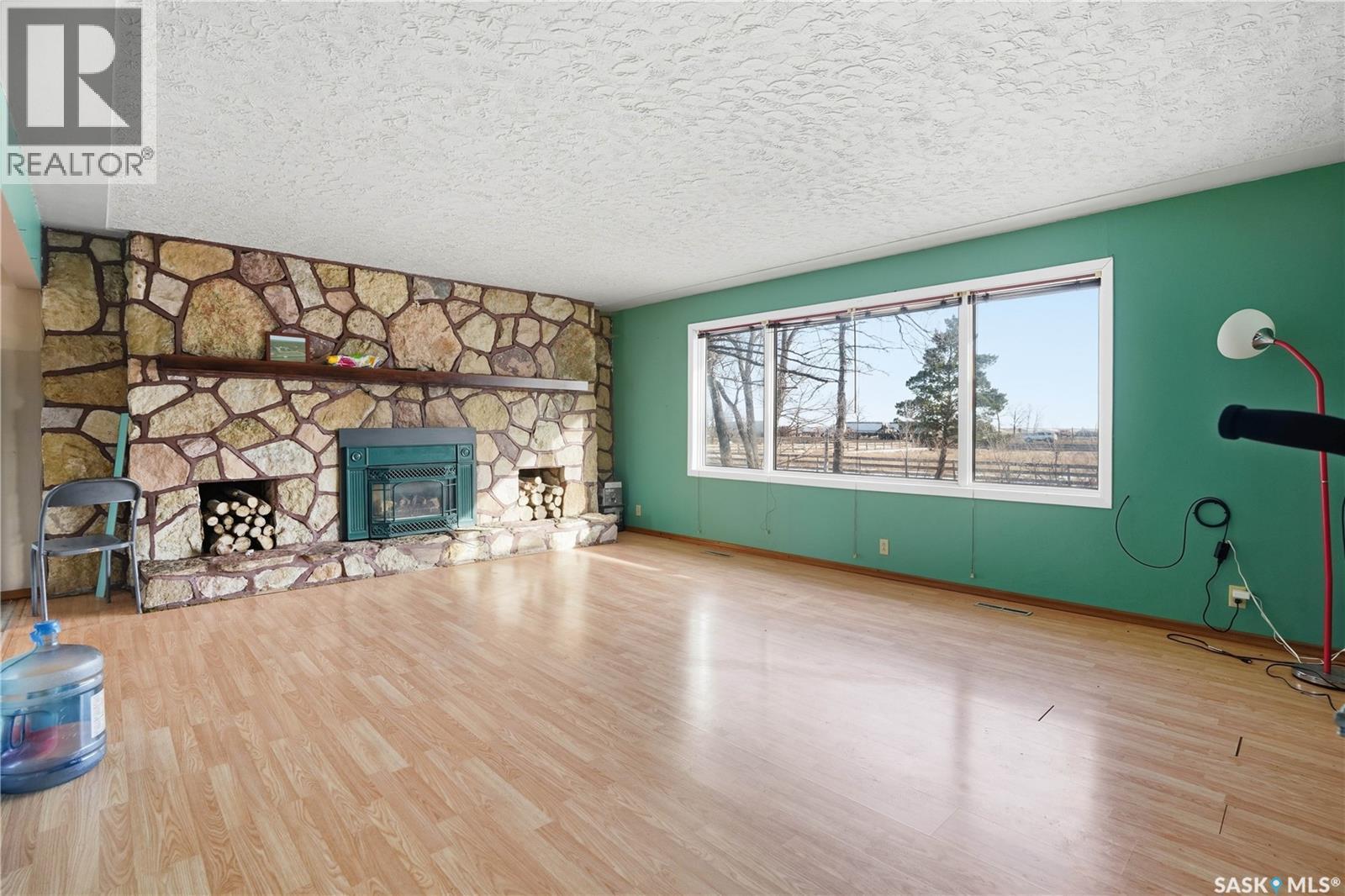 Chamberlain Acreage, Chamberlain, SK - Indoor Photo Showing Living Room With Fireplace