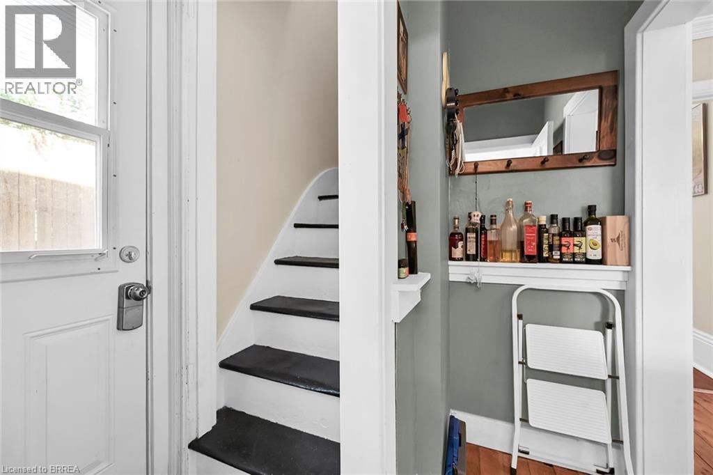 Stairs featuring hardwood / wood-style floors - 40 Locke Street S, Hamilton, ON - Indoor Photo Showing Other Room