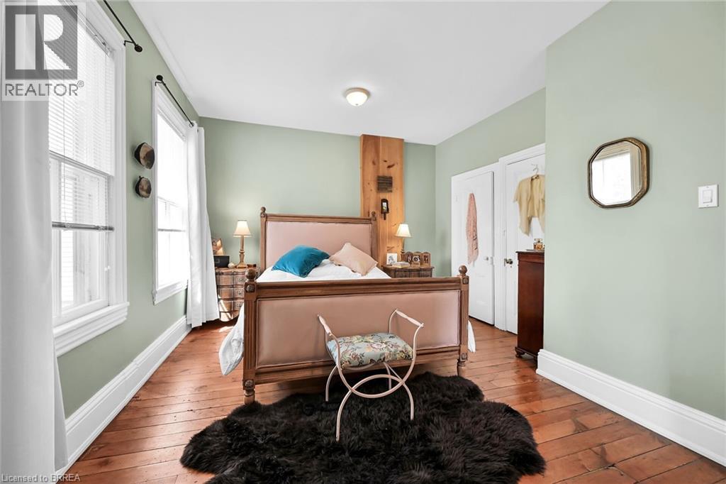 Bedroom featuring light wood-type flooring - 40 Locke Street S, Hamilton, ON - Indoor Photo Showing Other Room