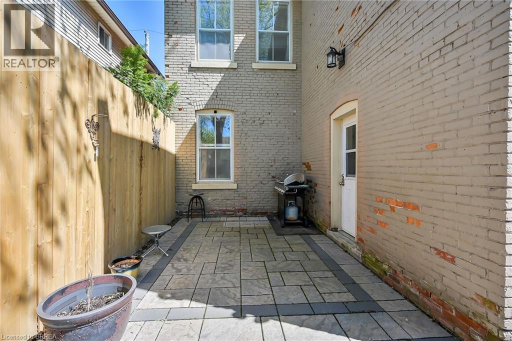 View of patio / terrace featuring a grill - 40 Locke Street S, Hamilton, ON - Outdoor With Exterior