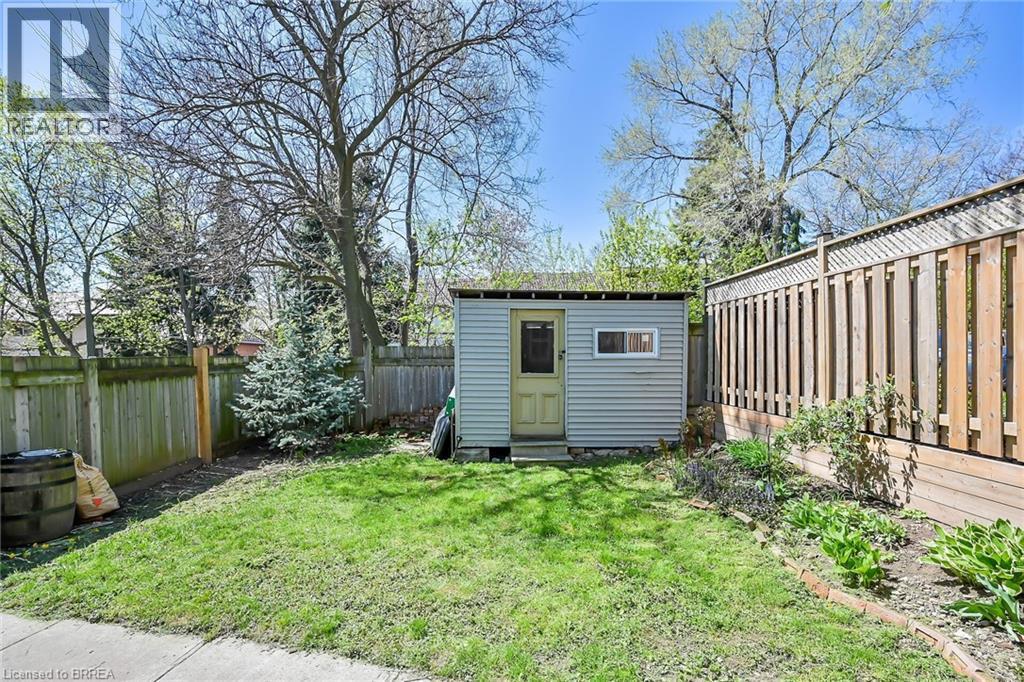 View of outdoor structure featuring a lawn - 40 Locke Street S, Hamilton, ON - Outdoor