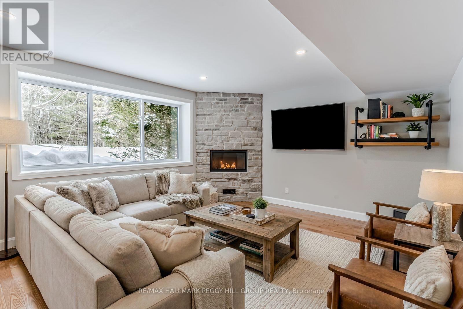 780 Marshall Road, Tiny, ON - Indoor Photo Showing Living Room With Fireplace