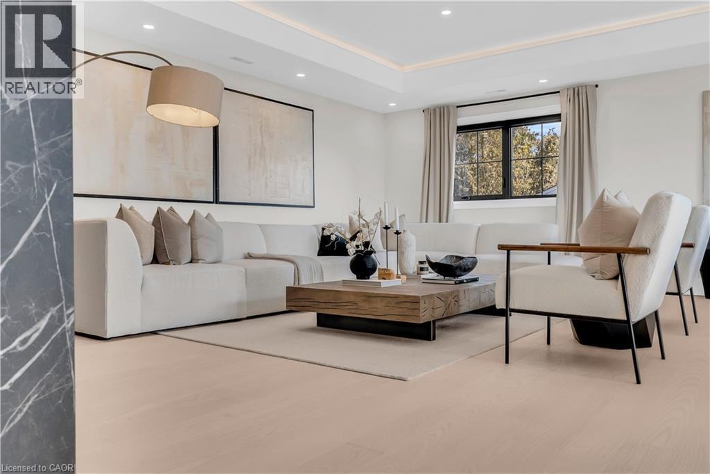 Living area with recessed lighting, wood finished floors, and a raised ceiling - 841 Danforth Place, Burlington, ON - Indoor Photo Showing Other Room
