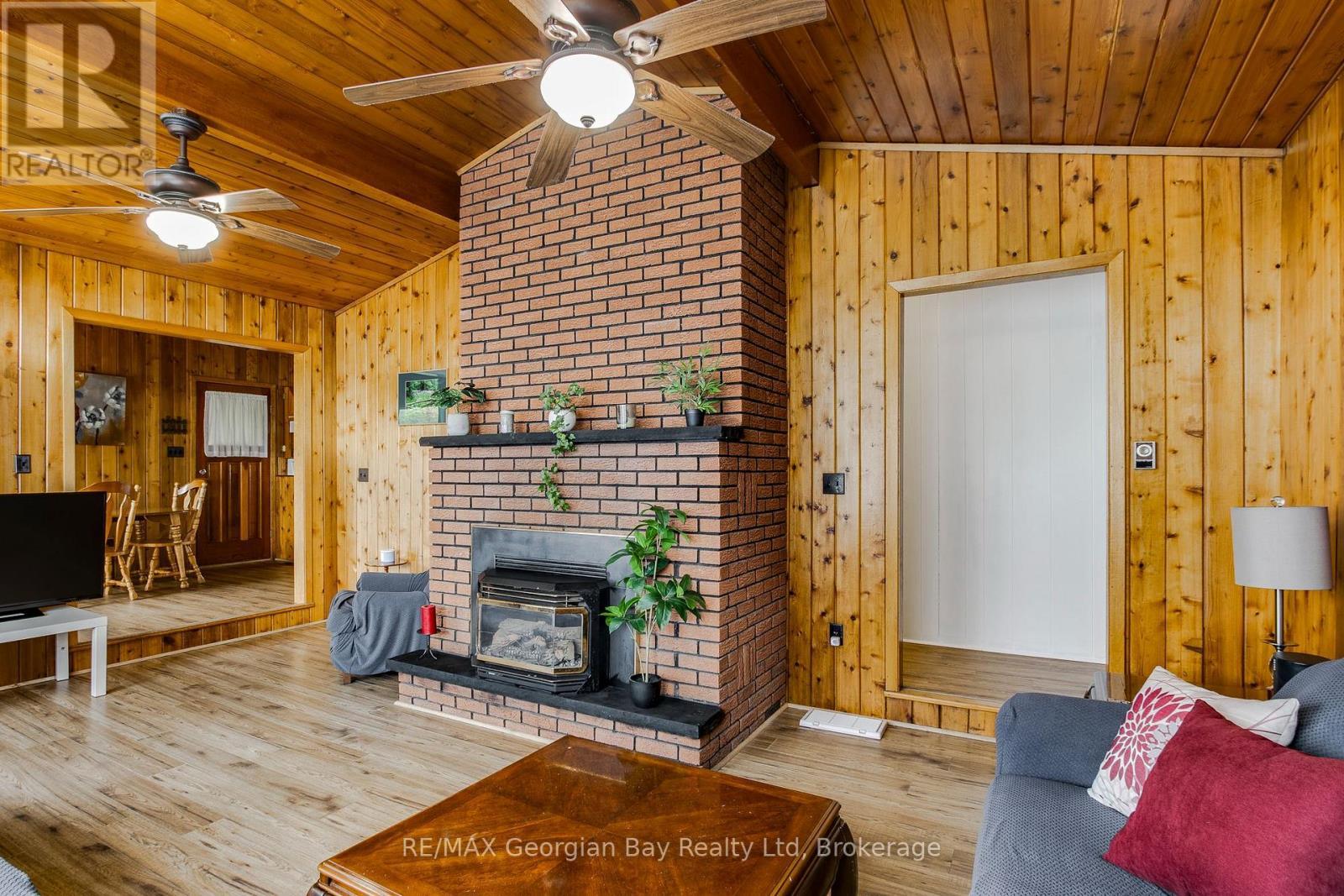 69 Albert Avenue, Tiny, ON - Indoor Photo Showing Living Room With Fireplace