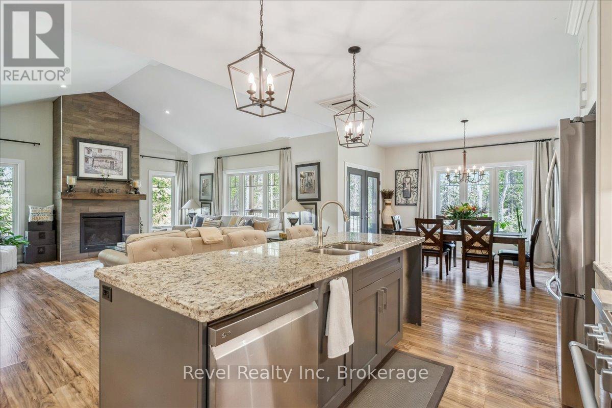 59 Trout Lane, Tiny, ON - Indoor Photo Showing Kitchen With Fireplace With Double Sink