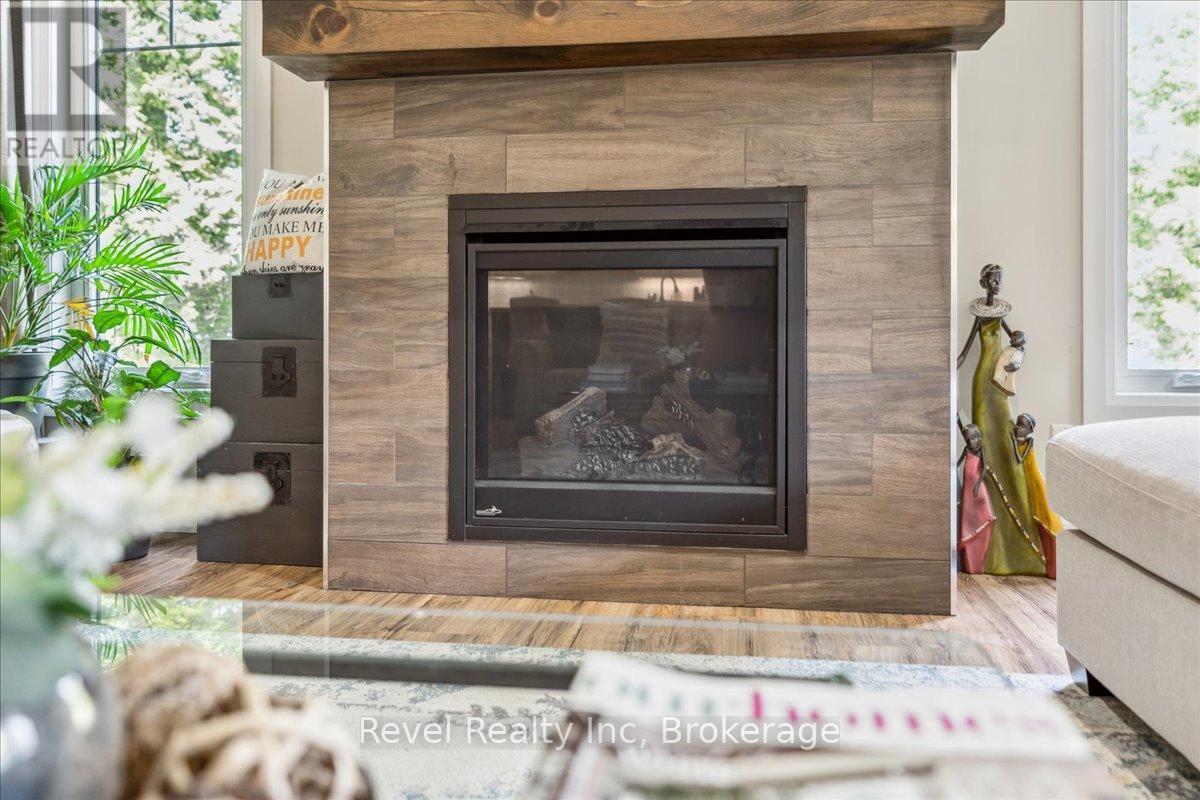 59 Trout Lane, Tiny, ON - Indoor Photo Showing Living Room With Fireplace
