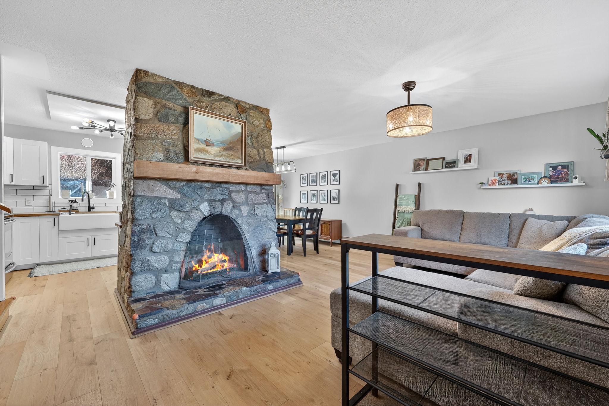 7312 Fintry Delta Road, Kelowna, BC - Indoor Photo Showing Living Room With Fireplace