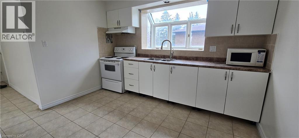 23 Rutherford Drive Unit# B, Kitchener, ON - Indoor Photo Showing Kitchen With Double Sink
